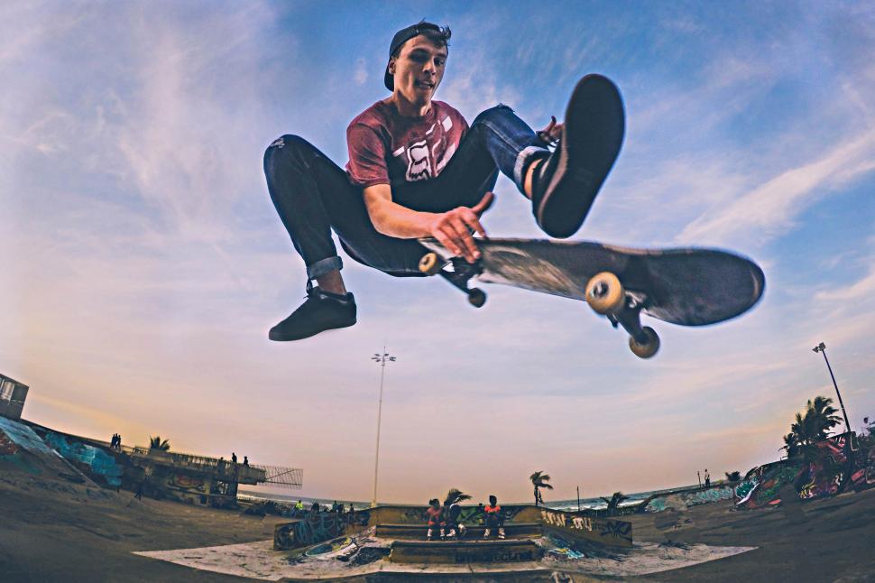 Free Stock Photo of A man jumping in the air with a skateboard ...