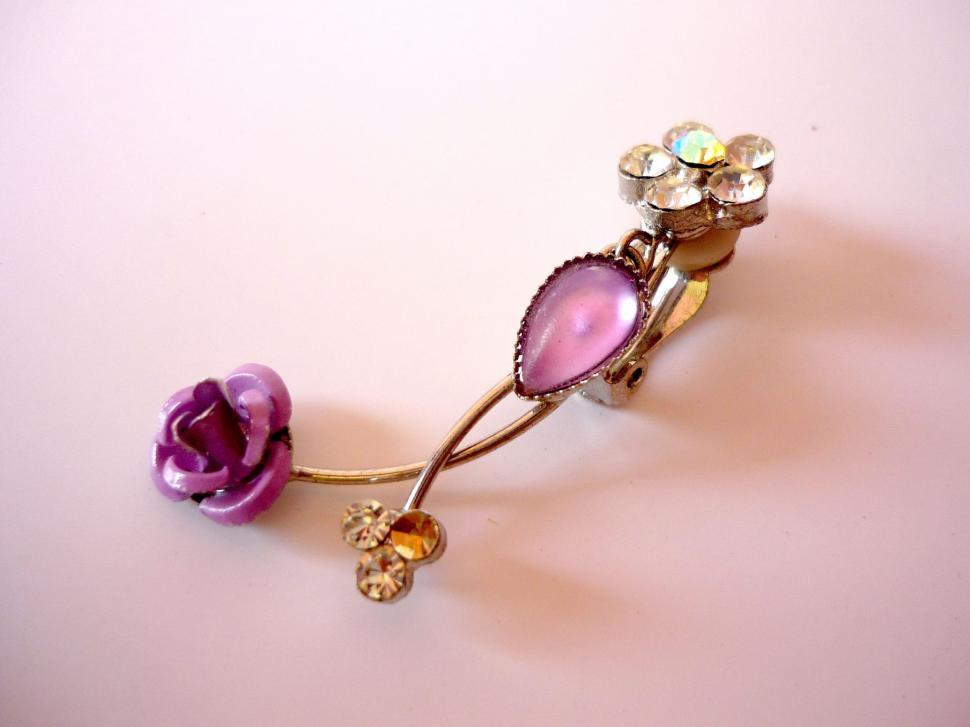 Free Image of Close Up of Flower Brooch on White Surface 