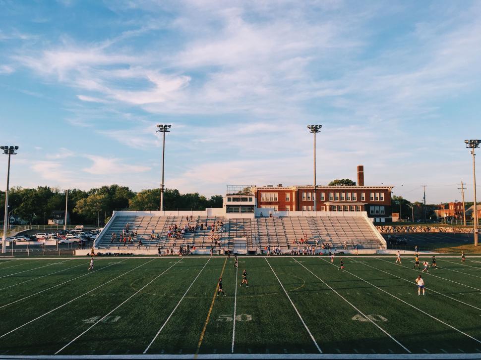 Free Image of A football field with people on the field 