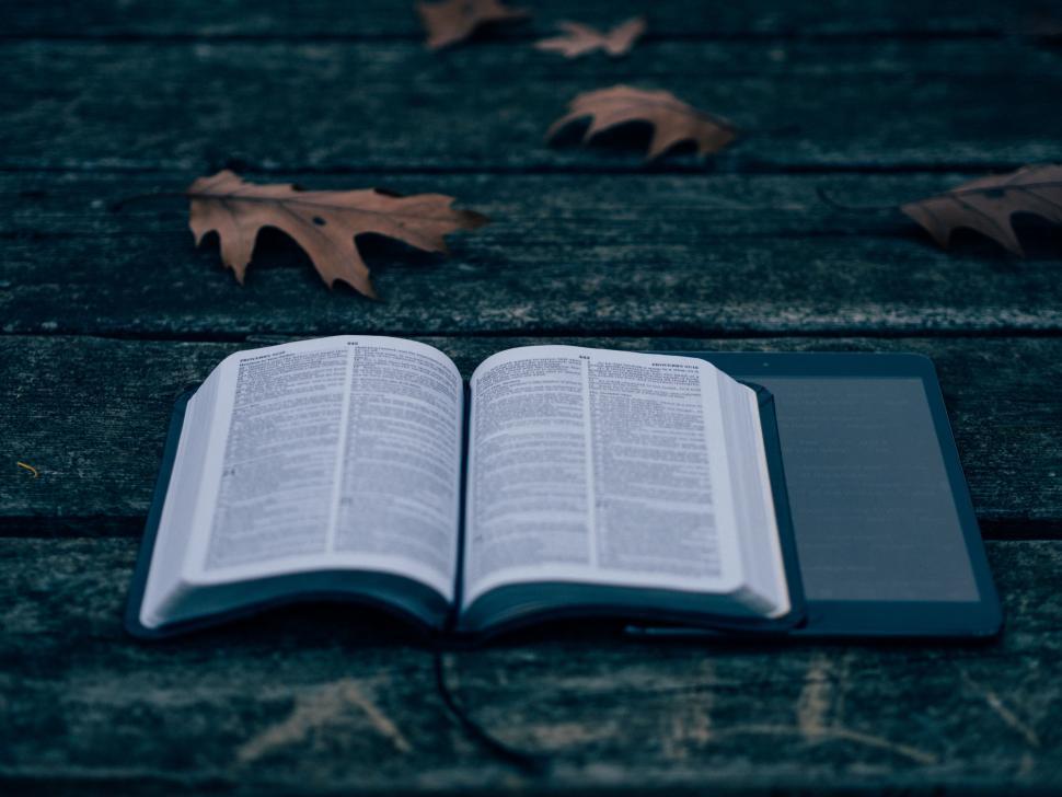 Free Image of A book and a tablet on a table 