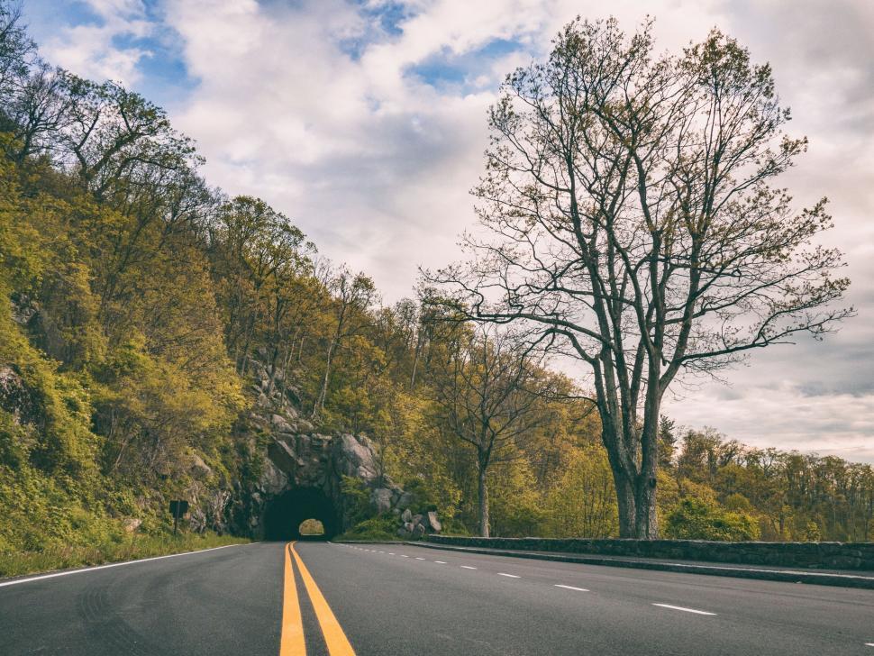 Free Image of A road with a tunnel in the middle of it 