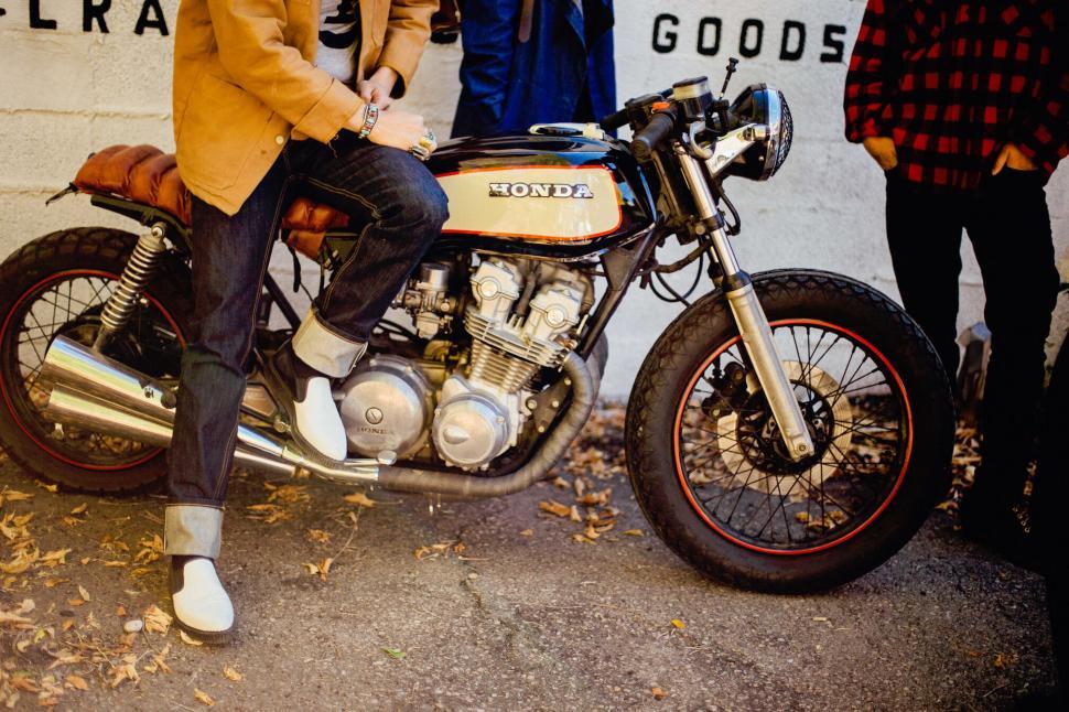 Free Image of A person sitting on a motorcycle 