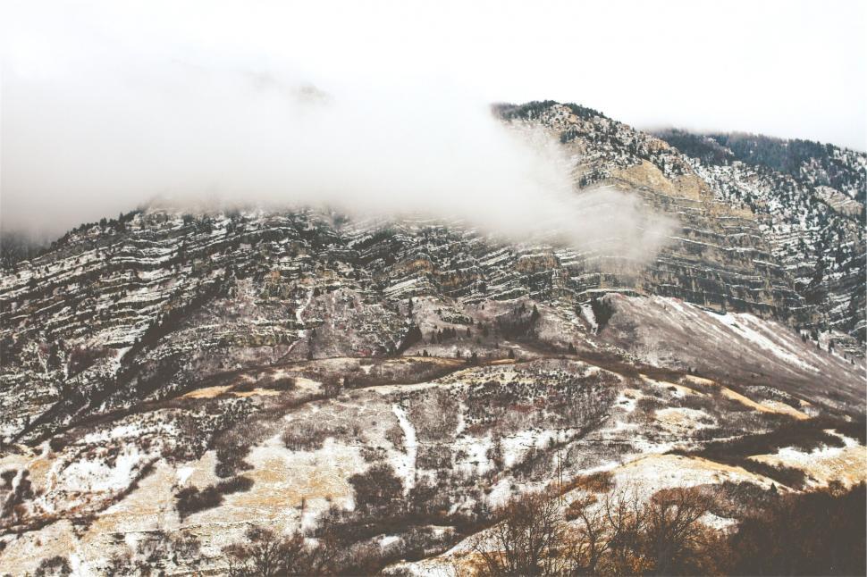 Free Image of A snowy mountain with clouds 