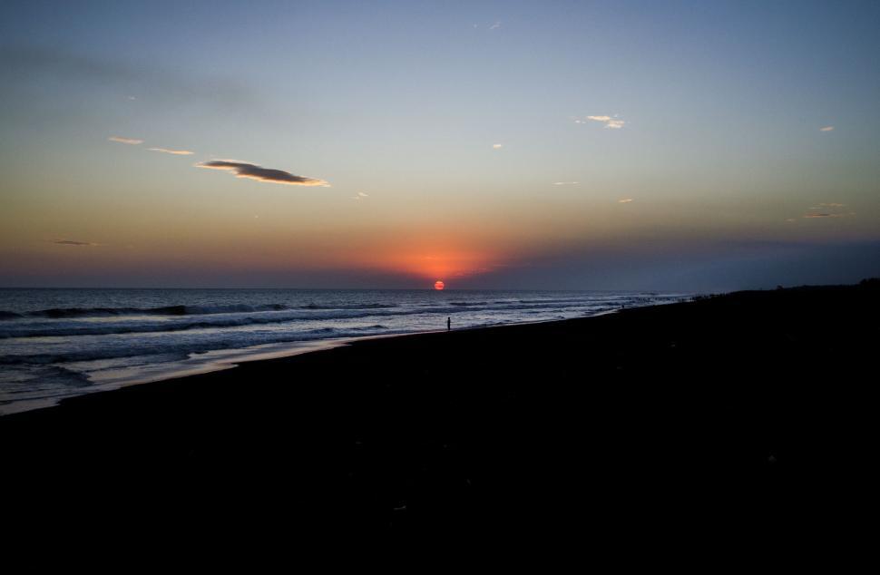 Free Image of A sunset over the ocean 