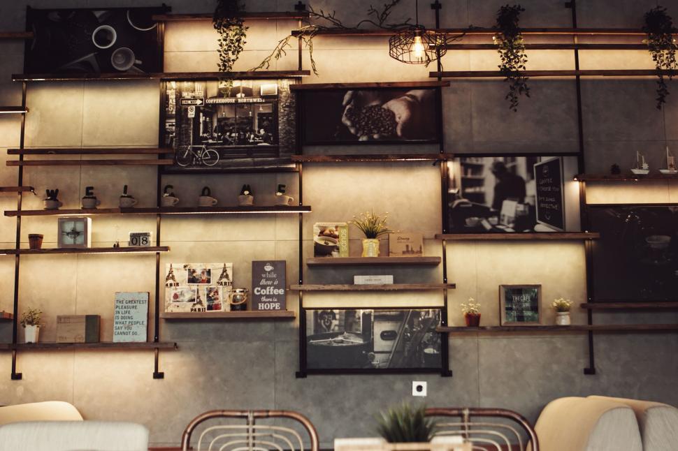 Free Image of A wall with pictures and shelves 