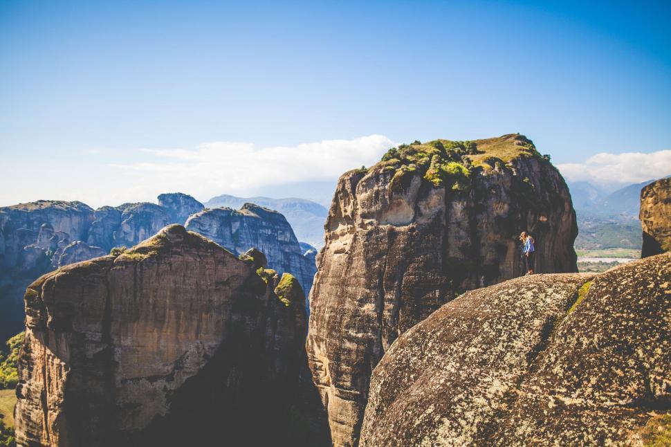 Free Image of A person standing on a rock 