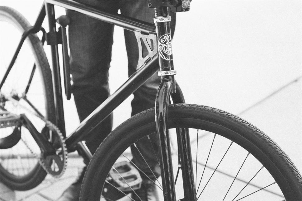 Free Image of A person holding a bicycle 