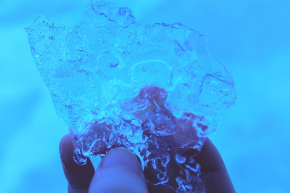 Free Image of A hand holding a piece of ice 