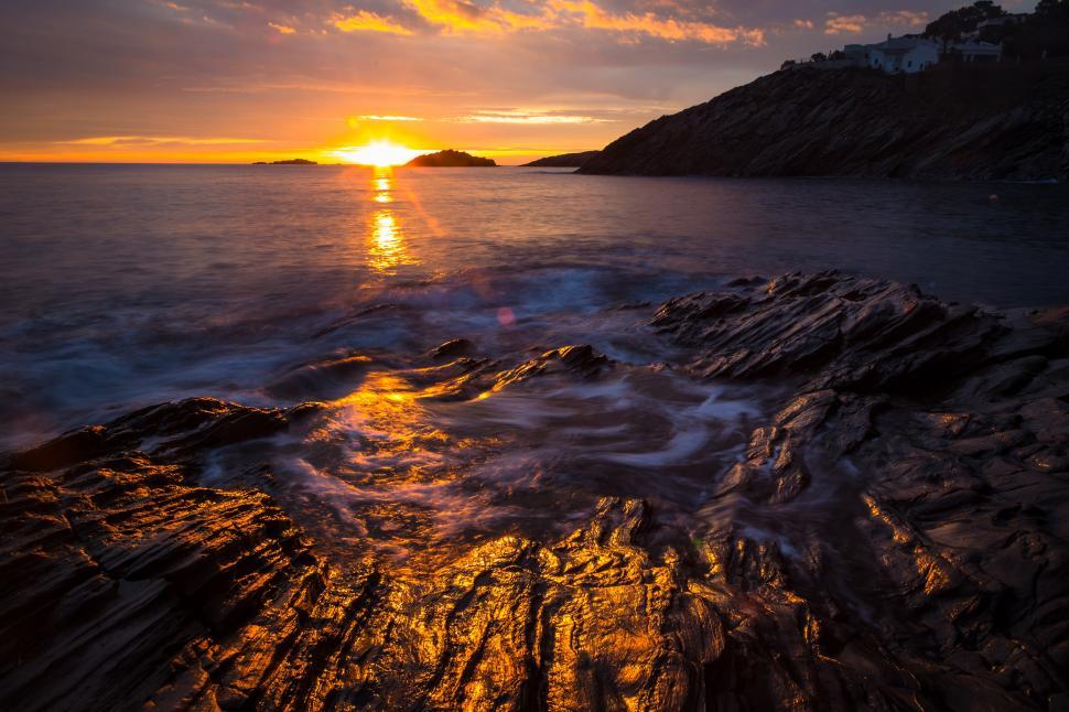 Free Image of A sunset over a body of water 