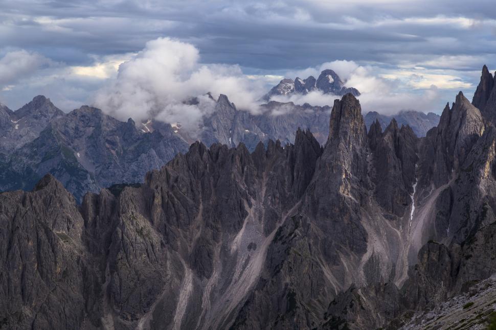 Free Image of A mountain range with clouds in the sky 