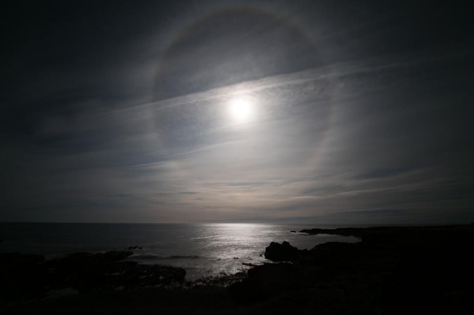 Free Image of A sun over a body of water 