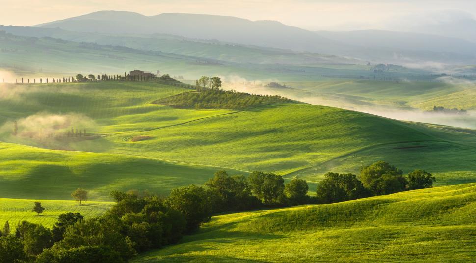 Free Stock Photo of A rolling hills with trees and a building ...