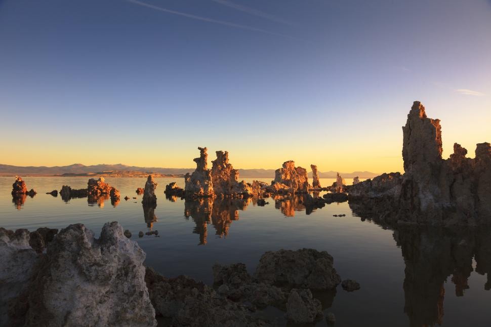 Free Image of A body of water with rocks in it 