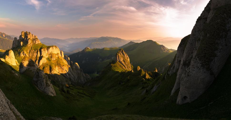 Free Image of A green mountains with a cloudy sky 