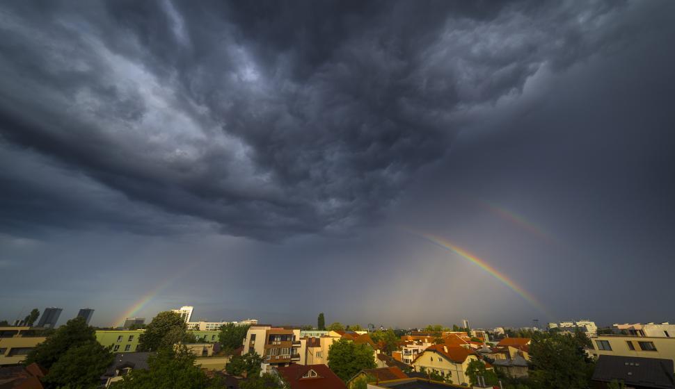 Free Image of A rainbow over a city 