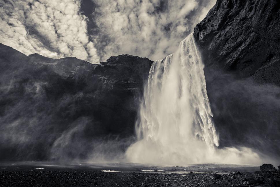 Free Image of A waterfall in a rocky area 