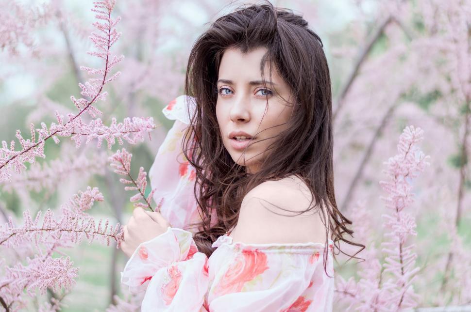 Free Image of A woman in a floral dress 