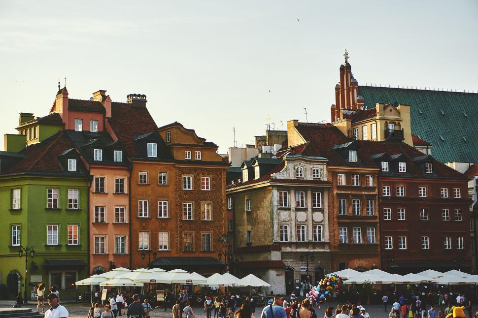 Free Image of A group of people walking around a city 