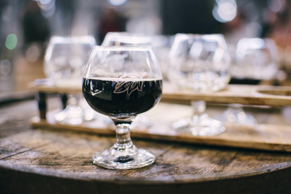Free Image of A glass of wine on a table 