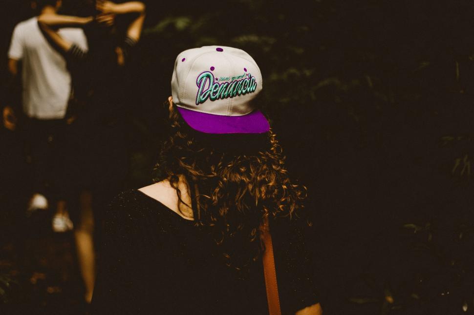 Free Image of A woman wearing a hat 
