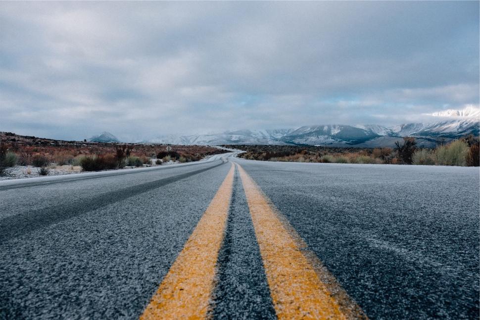 Free Image of A road with snow on the side 