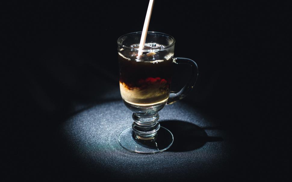 Free Image of A glass with liquid in it 