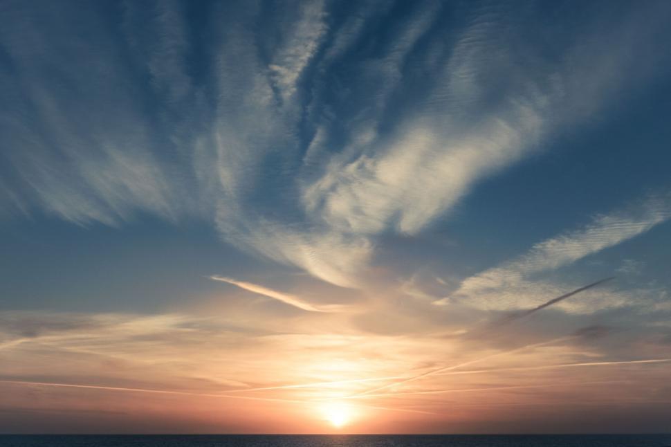 Free Image of A sunset over water 