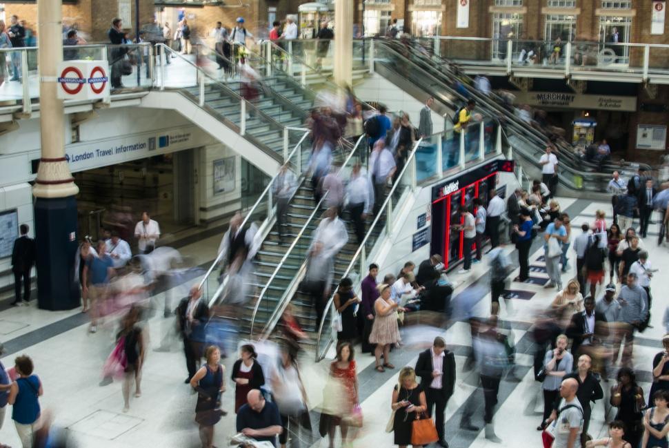 Free Image of A group of people on escalators 