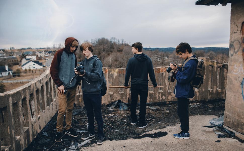 Free Image of A group of people standing on a bridge 