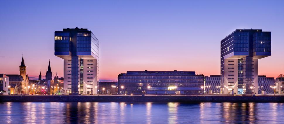 Free Image of A building next to a body of water 