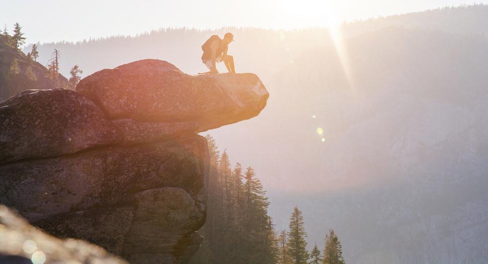 Free Image of A person standing on a rock 