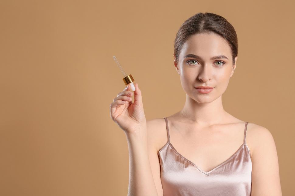 Free Image of A woman holding a dropper 