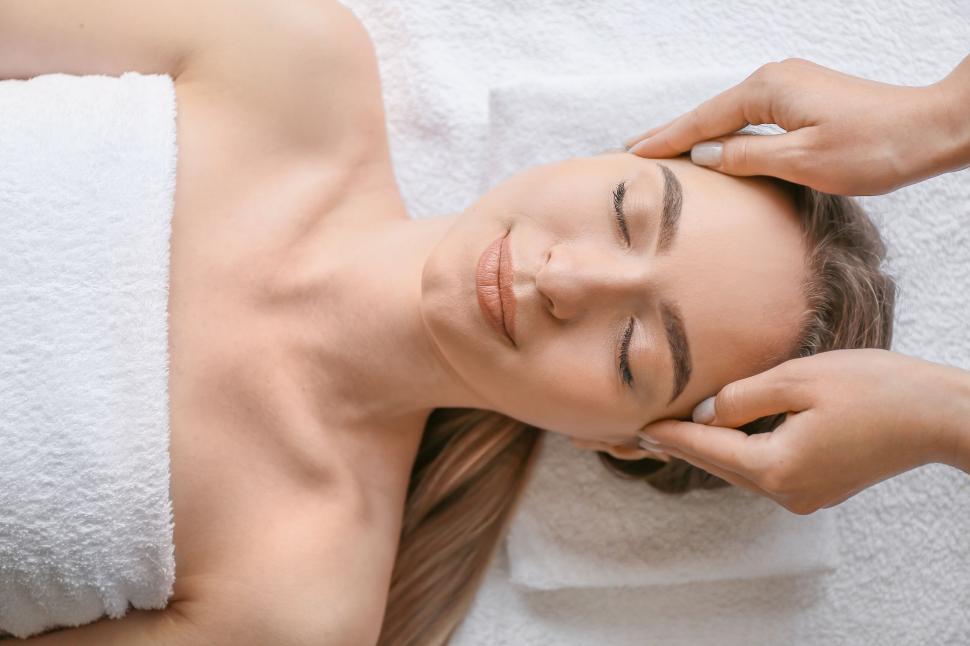 Free Image of A woman lying down with her eyes closed 