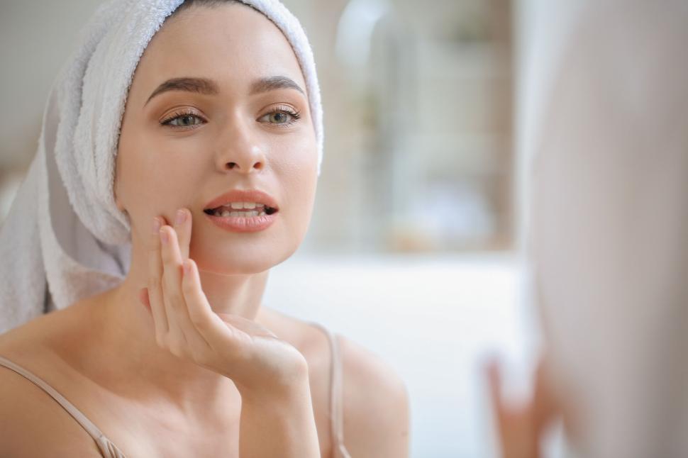 Free Image of A woman with a towel on her head 