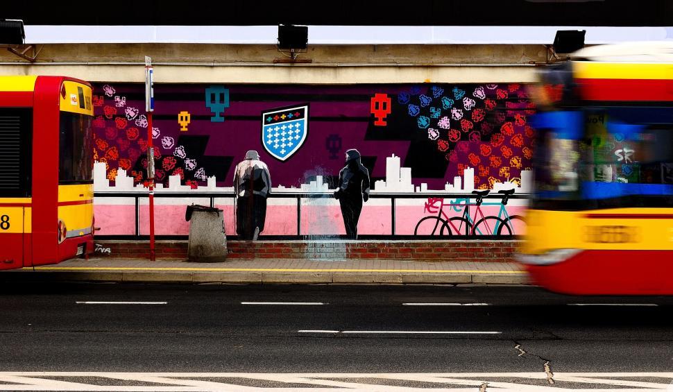 Free Image of City scene with tram and pedestrians 