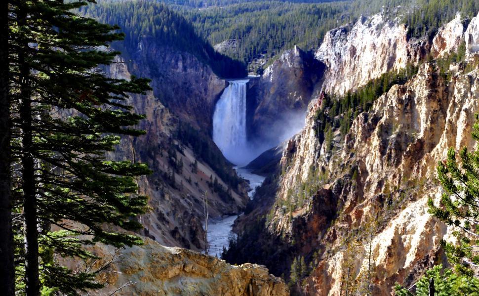 Free Image of Waterfall in a majestic mountain gorge 