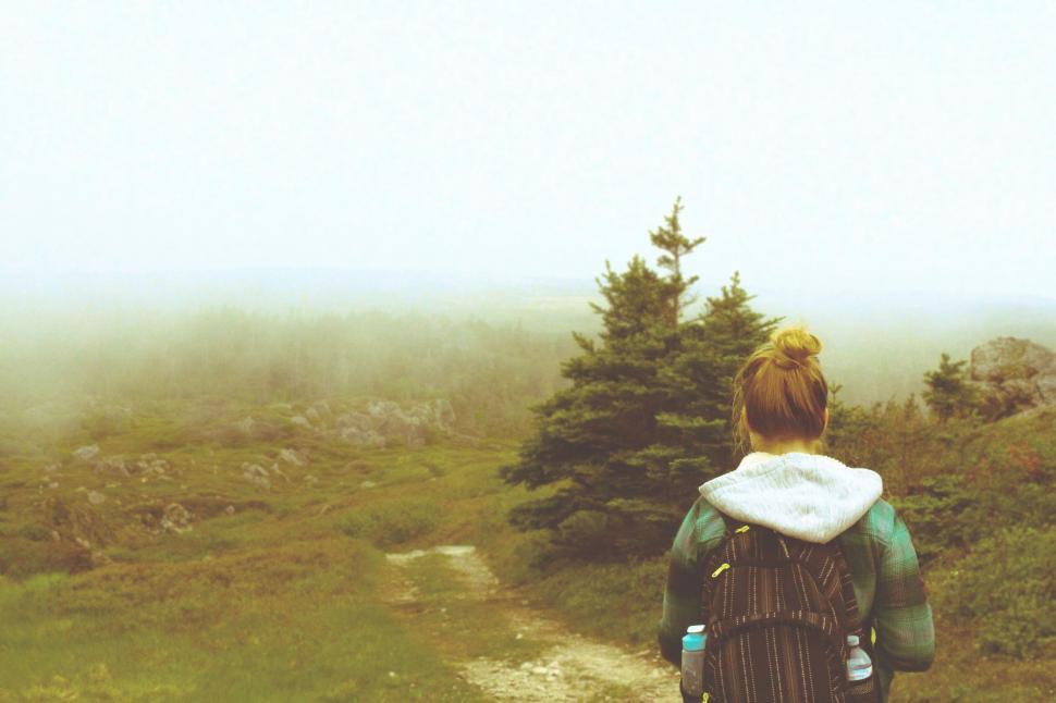 Free Image of Hiker observing fog-covered landscape 