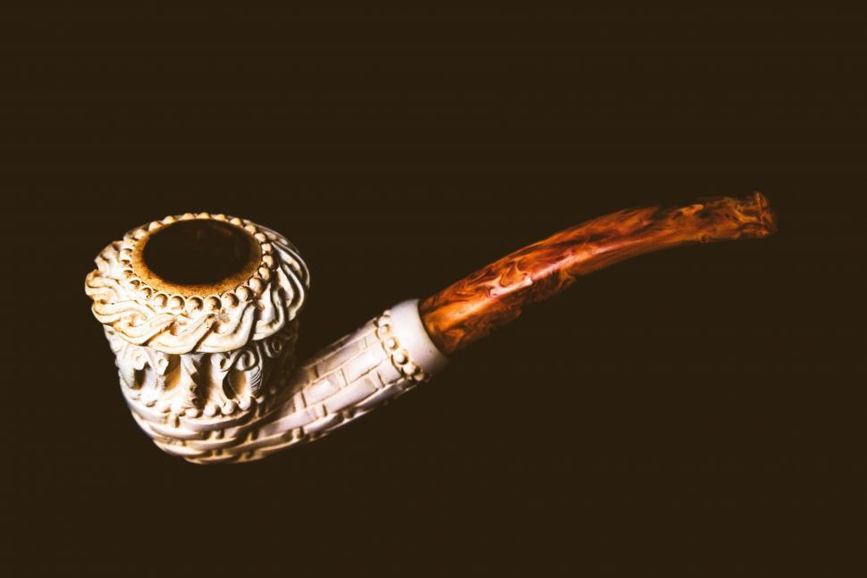 Free Image of Vintage-inspired smoking pipe on dark background 