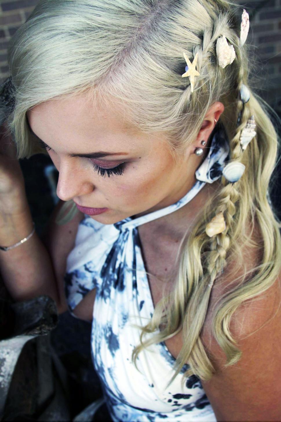 Free Image of Blonde hair with natural decorations from seaside 