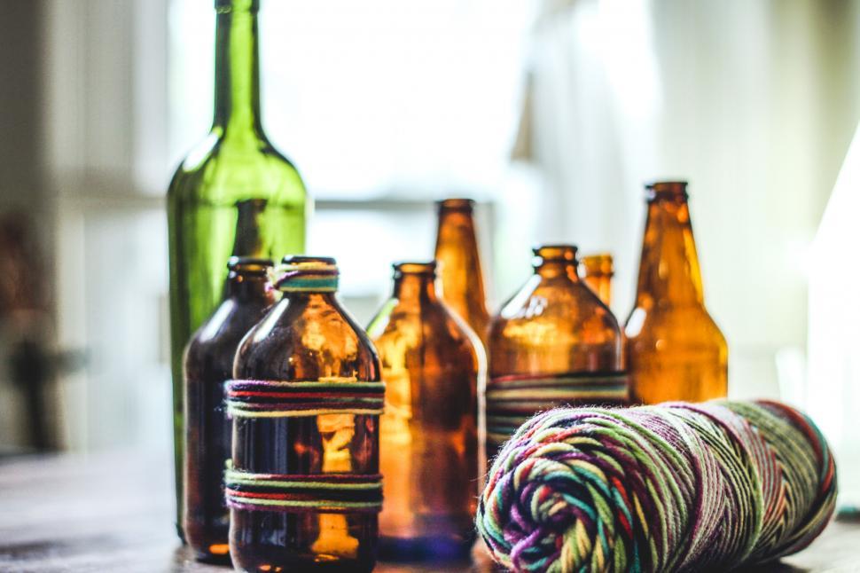 Free Image of Rustic glass bottles on a wooden table 