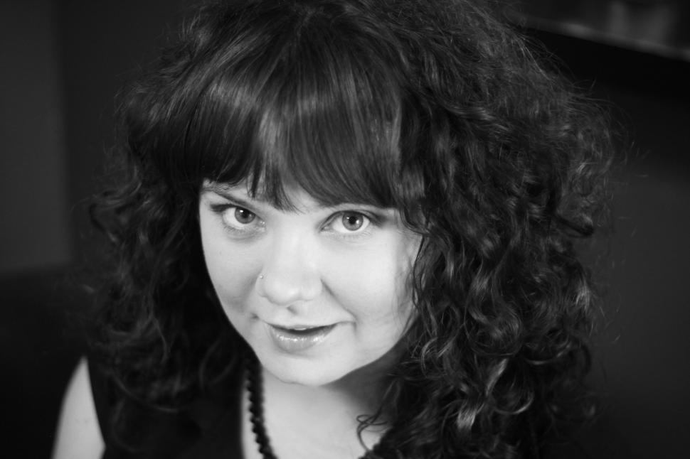 Free Image of Monochrome portrait of a smiling woman 