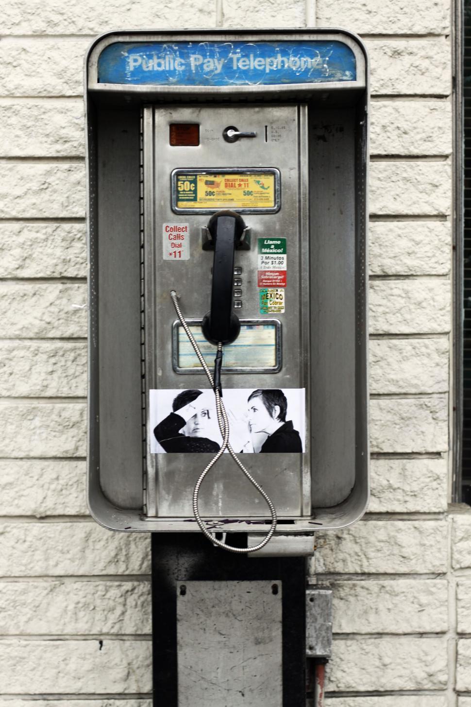 Free Stock Photo of Public telephone with a photograph Download Free