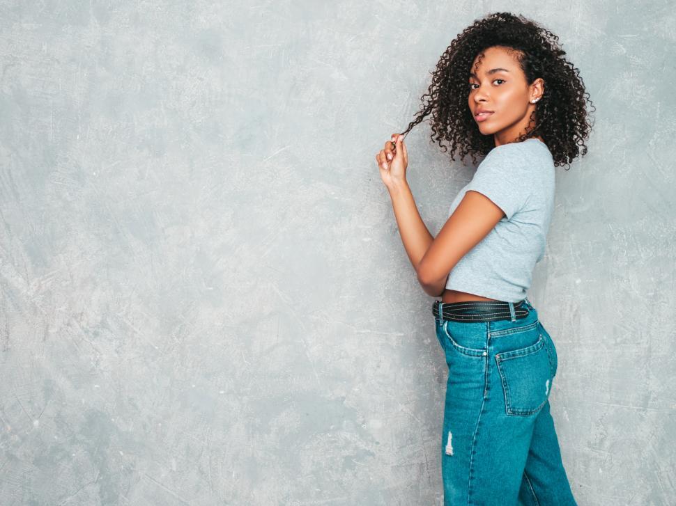 Free Image of A woman with curly hair 