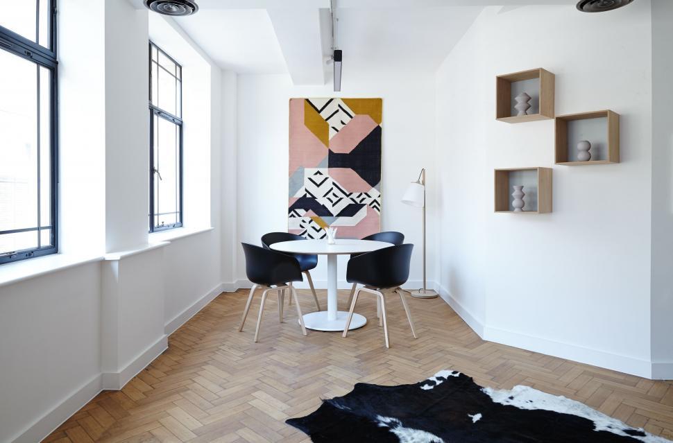 Free Image of Modern dining area with abstract wall art 