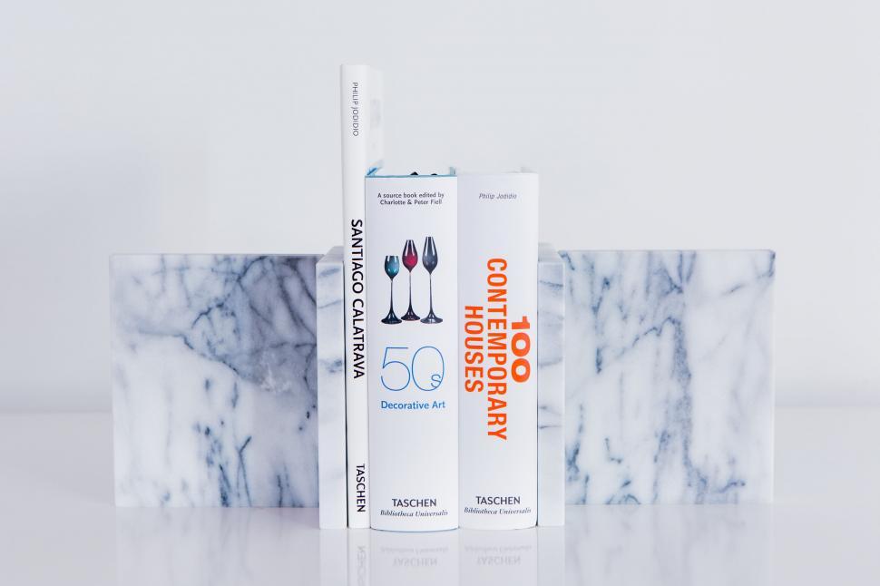 Free Image of Art and design books on marble surface 