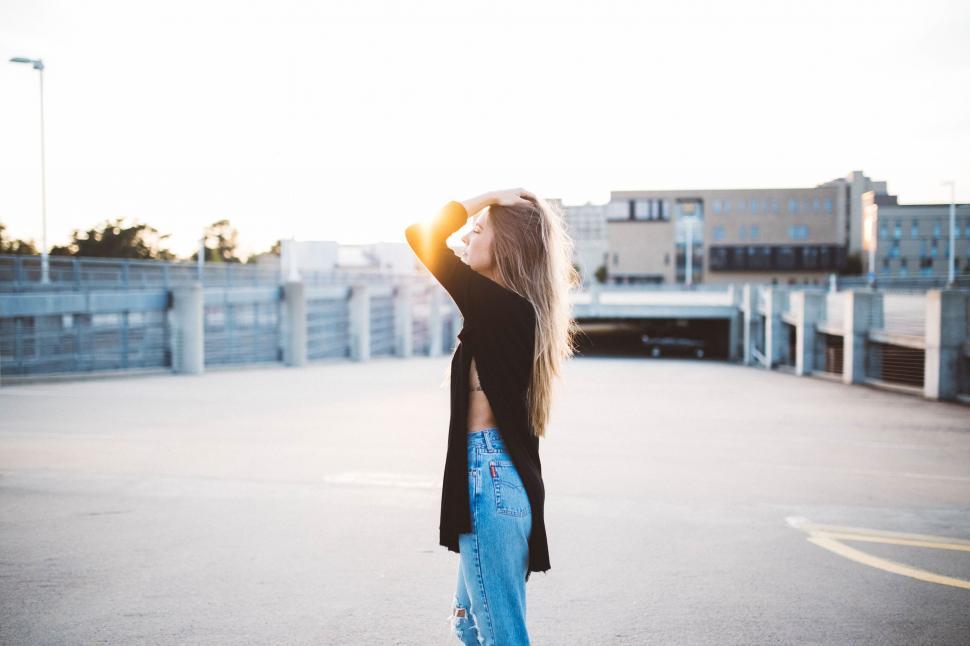 Free Stock Photo of Backlit figure against urban sunset backdrop ...