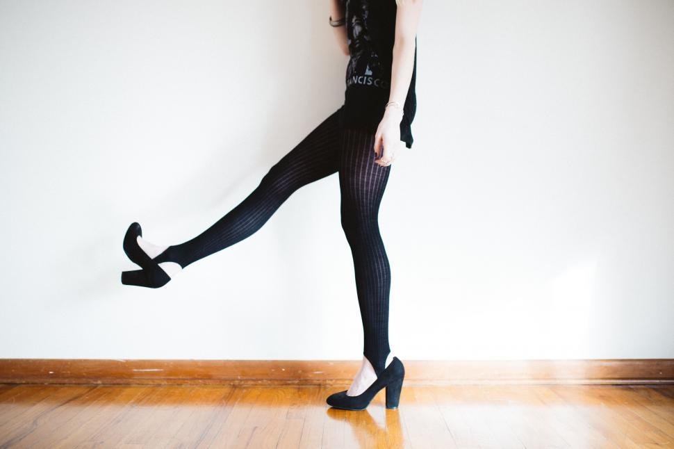Free Image of Woman in striped pants with black heels 