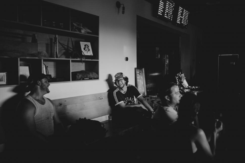 Free Image of Silhouetted group laughing in a cafe 