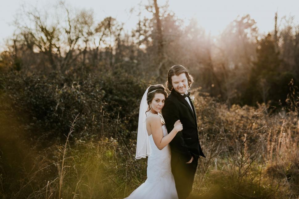 Free Image of Bride and groom sharing a candid moment 