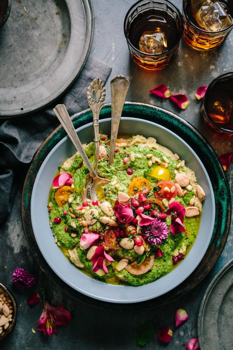 Free Image of Colorful green soup with floral garnish 